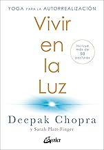 Vivir en la luz: Yoga para la autorrealización. Incluye más de 50 posturas